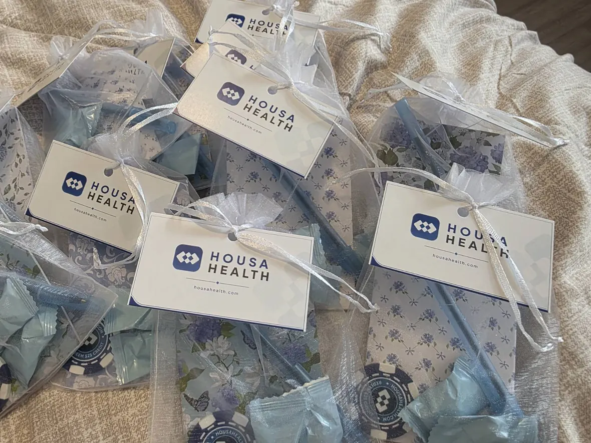 Housa Health conference giveaway bags and branded materials