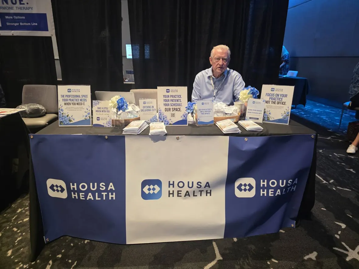 Conference table and Housa Health print materials