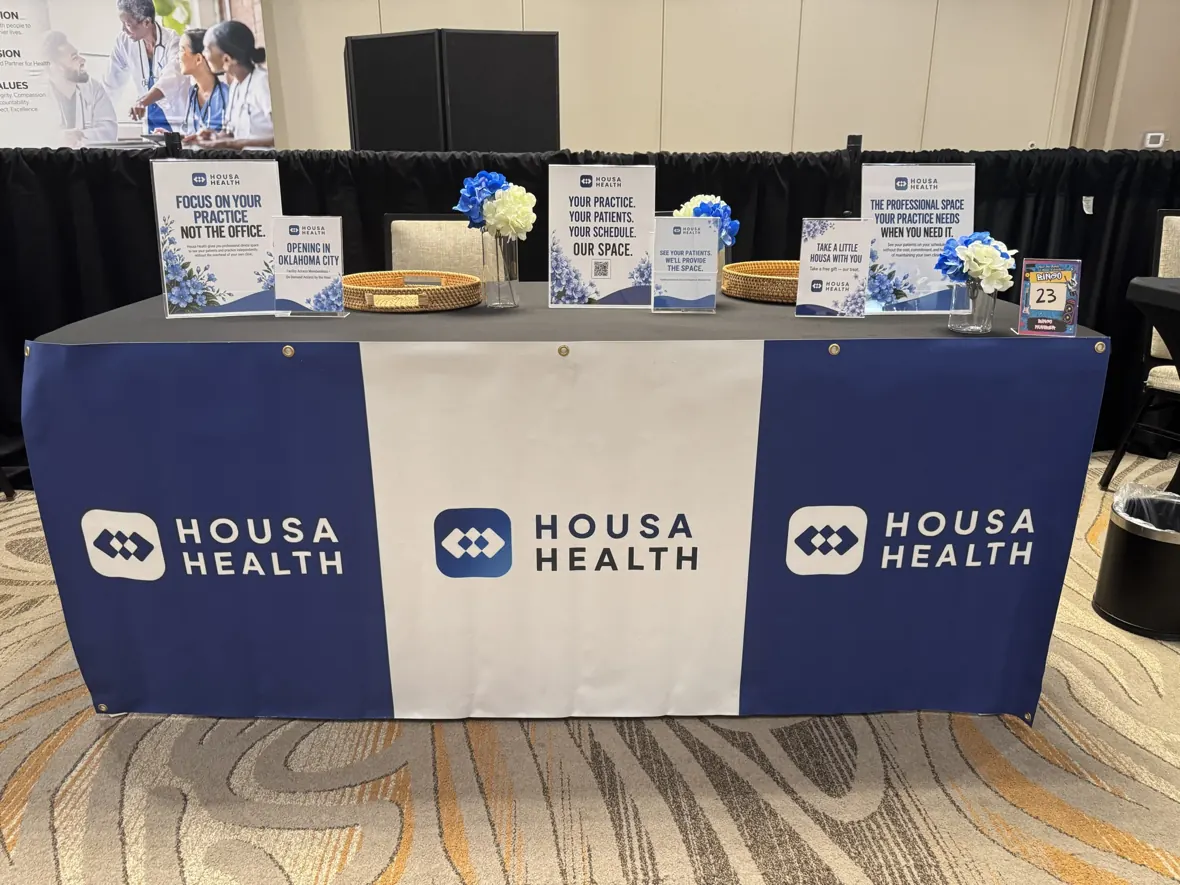 Housa Health branded exhibition table at the OAPA annual conference