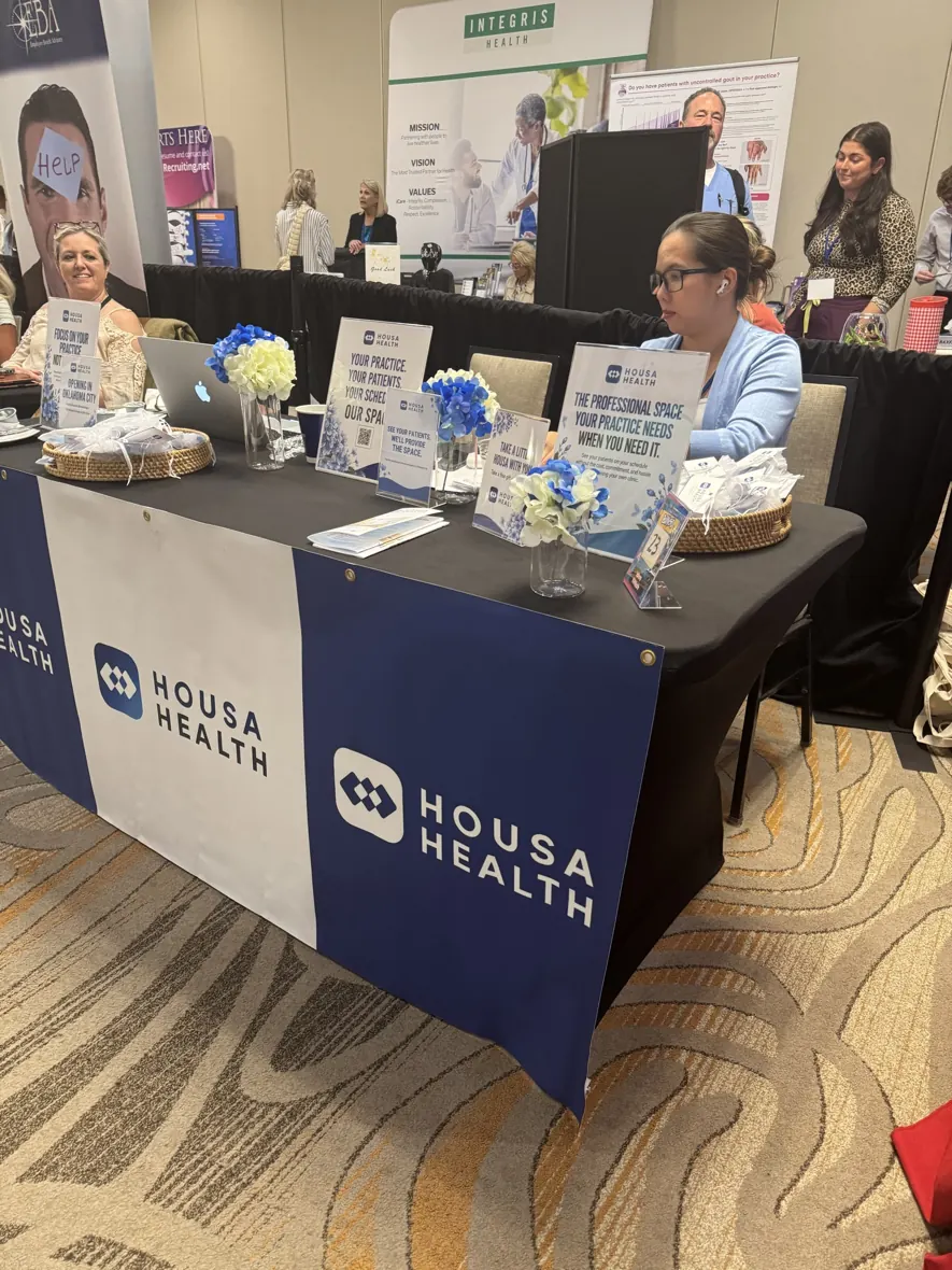 Housa Health exhibition staff and visitors at the physician associates conference